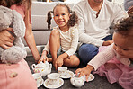 Happy, kids and children at play date have tea party, fun and playing together on home living room floor. Development, youth and group of little girl friends imagine they're a princess at royal party