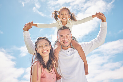 Buy stock photo Happy family portrait and smile together in summer with a blue sky background. Energetic dad and mother play and having fun with their child. Cheerful father carrying daughter on shoulders outdoor 