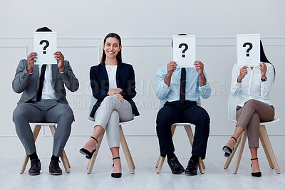 Buy stock photo Job interview, question mark and feedback with business people sitting with sign for review, recruitment and search. Why, faq and hiring with employees holding icon for opinion, vote or policy
