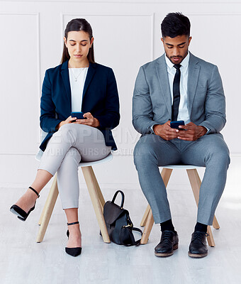 Buy stock photo Hiring, interview and phone of businessman and woman with diversity in a office waiting room. Corporate potential workers wait for a company human resources meeting with technology and 5g internet
