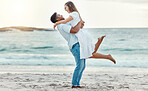 Man hug and lift woman on beach celebrate love with smile near water on summer holiday, vacation or luxury sea travel. Happy couple or people, celebration and together on tropical ocean sand in Bali