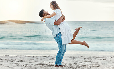 Buy stock photo Man hug and lift woman on beach celebrate love with smile near water on summer holiday, vacation or luxury sea travel. Happy couple or people, celebration together on tropical ocean sand in Bali