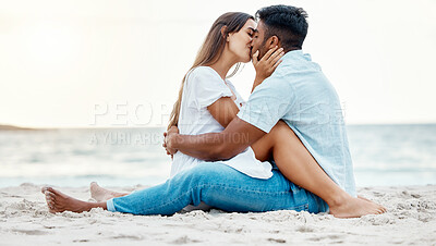 Buy stock photo Kiss, beach and love of couple on a date for anniversary, valentines day or romance summer holiday with clear sky, ocean waves and sand. Romantic, intimate and marriage honeymoon or engagement people