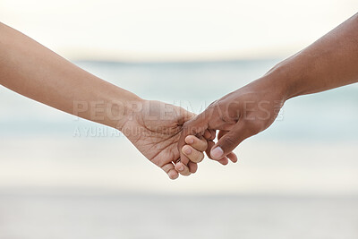 Buy stock photo Touch, love and support with interracial couple holding hands in a committed, loving and close relationship. Closeup hands of man and woman enjoying beach travel, sea vacation or holiday and romance