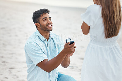 Buy stock photo Proposal, surprise and engagement with wedding ring on beach with indian man on knee for love, commitment and marriage. Save the date, gift and diamond jewellery present for woman for romance