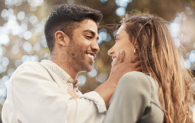 Buy stock photo Happy couple, love and commitment while outside at a park sharing a romantic moment and looking into eyes with a smile. Safe, secure and happy man and woman showing appreciation, bond and connection