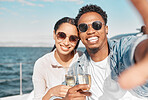 Anniversary, smiling and celebrating with champagne in hand taking a selfie while on a boat in summer. Happy, content and beautiful young people with a joyful face on holiday drinking wine together 