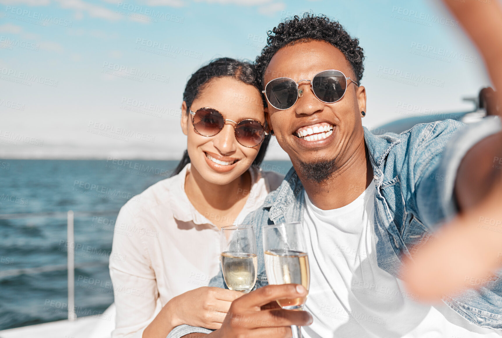 Buy stock photo Yacht, luxury and sea travel couple with champagne smiling on their anniversary in summer. Happy, love smile and ocean selfie of a woman and man on holiday with happiness drinking alcohol together 