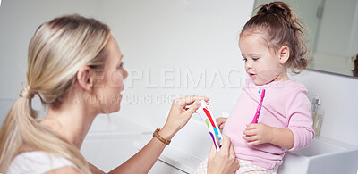 Buy stock photo Baby kid brushing teeth with mom in bathroom, morning oral hygiene and clean dental healthcare wellness. Parent with toothpaste and toothbrush teaching young toddler girl child healthy mouth cleaning