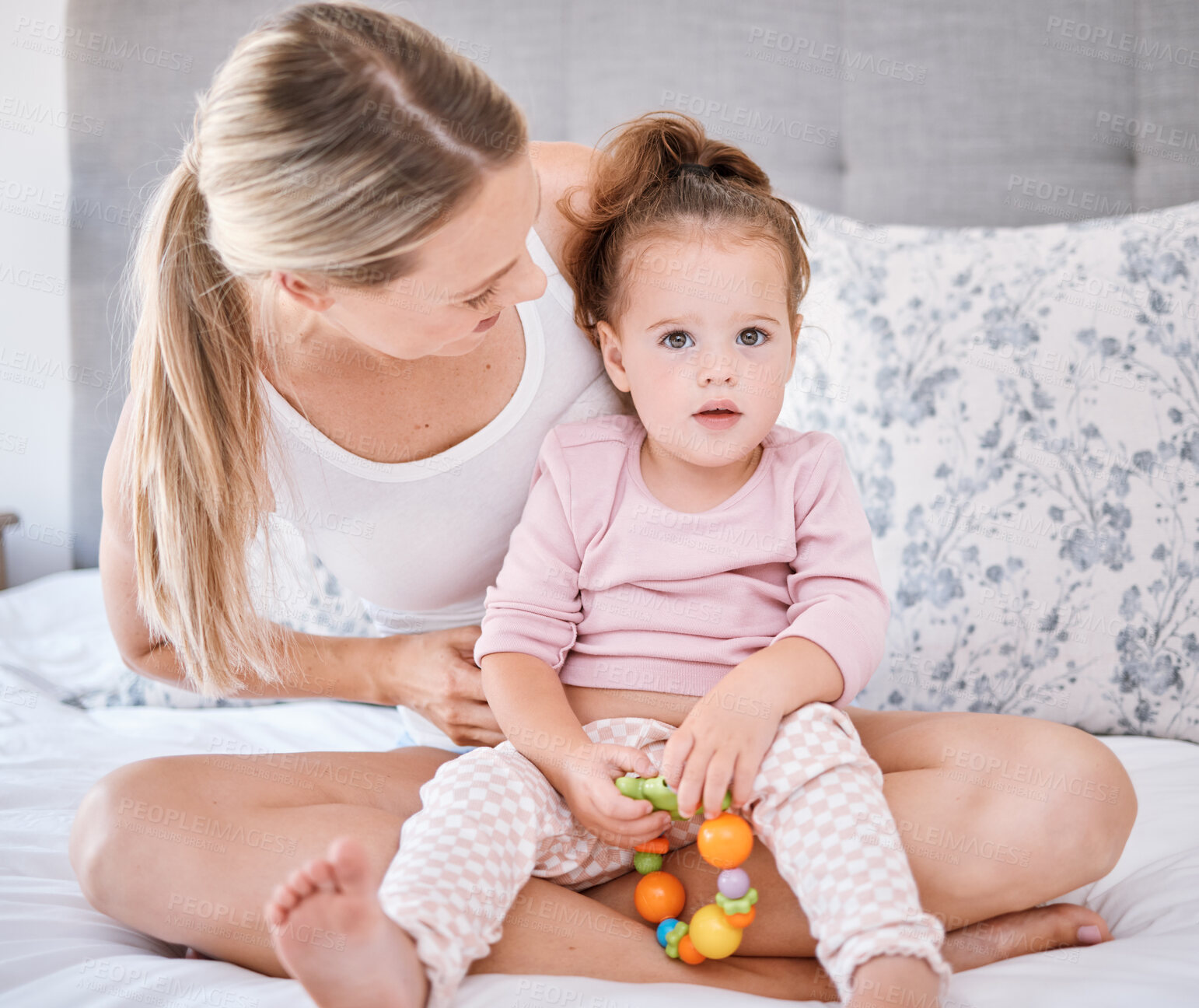 Buy stock photo Portrait of girl with mother in bedroom in home, bonding and playing while holding toy. Love, family and caring happy woman with little kid, child or toddler spending free time together in the house
