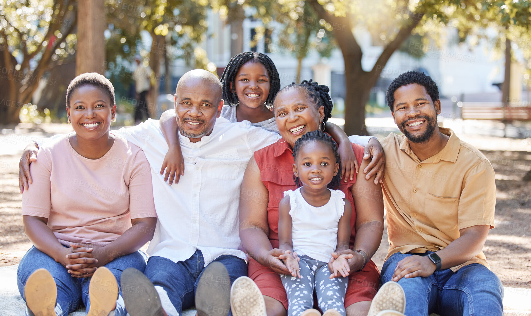 Buy stock photo Happy portrait of a black family in nature with mother, grandparents and children smiling next to father. Mom, dad and kids love quality time with senior African woman at a park in summer on holiday