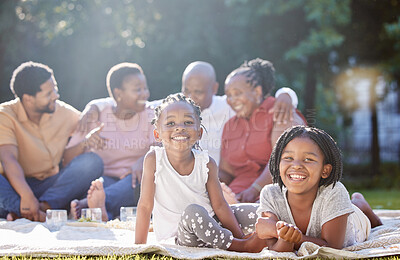Buy stock photo Happy children, picnic and black family relax, bond and enjoy free time together in nature. Portrait of little African sisters smile in happiness for summer outdoors with parents and grandparents
