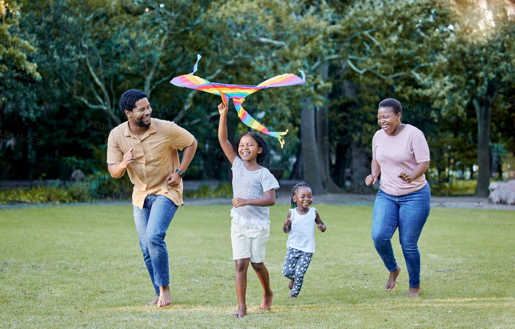 Buy stock photo Black family, kite and outdoor fun with parents and children having fun and playing outside at a park in nature. Energy, love and running while being active and bonding with man, woman and kids