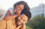Happy, black father and daughter smiling on back in joyful happiness and bonding in the outdoor nature. African little girl smile, laughing and enjoying time with caring dad in the summer outside