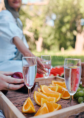 Buy stock photo Outdoor, champagne and fruit for picnic in the park with friends for health, brunch and relax. Summer, food and glass of wine with women in the countryside garden for nature, social event and party