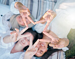 Peace, friends and hand sign while happy women bond, have fun and support each other while on a picnic at a park in nature. Above view, flare and star gesture with diversity females enjoying freedom