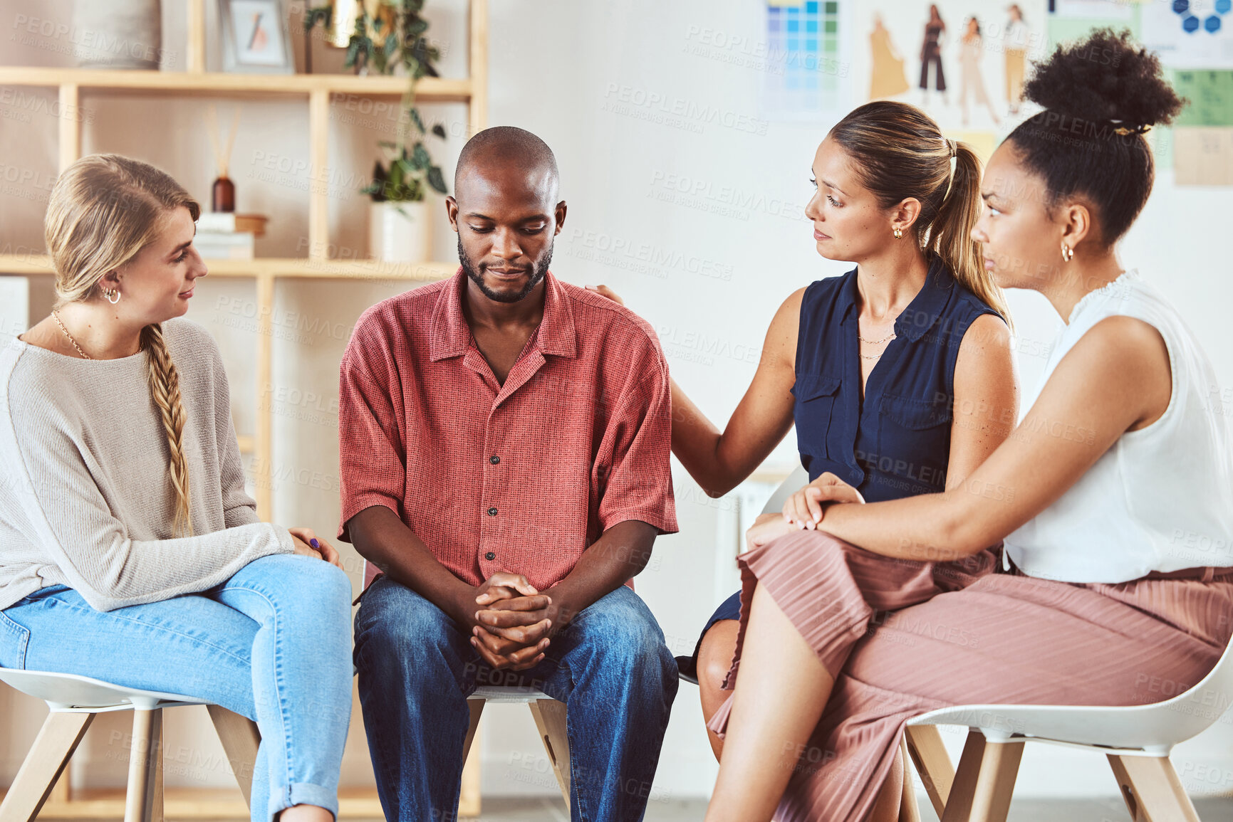 Buy stock photo Group therapy, support or mental health community in comfort of sad black man with anxiety, depression or stress. Diversity friends, women or people in counseling in psychology trust meeting for help