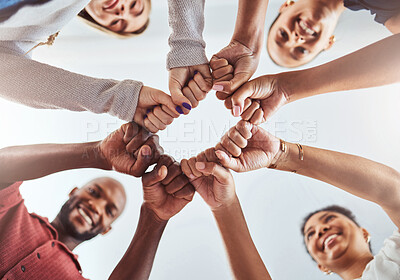 Buy stock photo Teamwork, unity and hands or fist for support, trust and community below blue sky. Diversity group men and women friends standing together for teamwork, collaboration and help during team building