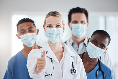 Buy stock photo Thumbs up, covid and doctors with nurses with mask at hospital or clinic. Portrait, health goal or approval hands after successful surgery, okay for success or yes welcome to the team and thank you.
