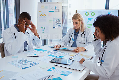 Buy stock photo Healthcare, thinking and team of doctors in meeting with medical statistics in hospital boardroom. Data, analytics and research, overworked men and women in medicine with stress for vaccine results.