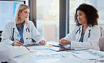 Doctors leadership meeting discussion for finance report, medical analytics or hospital planning with document paperwork. Women or people in healthcare communication on financial chart and technology