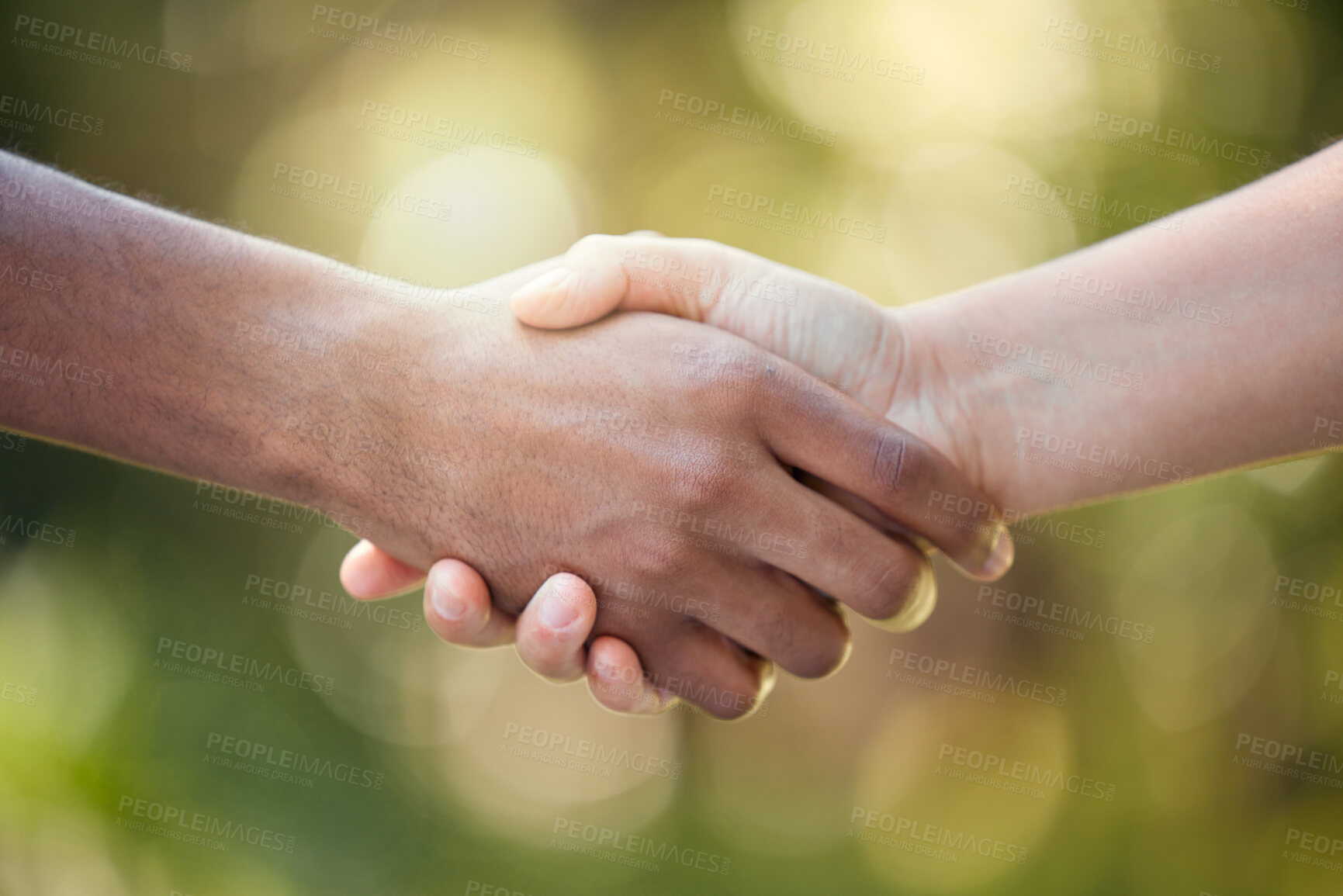 Buy stock photo Community, handshake and support hand sign of diversity to show solidarity and trust. Welcome or greeting of hands together showing collaboration, partnership or deal agreement outdoors with bokeh