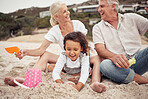 Family, beach and children with a girl and her grandparents playing in the sand outside during summer. Kids, love and vacation with a man and woman and granddaughter laughing and bonding outdoor