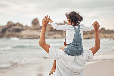 Buy stock photo Beach water, dad and child on family holiday together for a fun summer break to bond in nature. Happy father and kid enjoy ocean vacation with young girl holding parent for balance on shoulders.