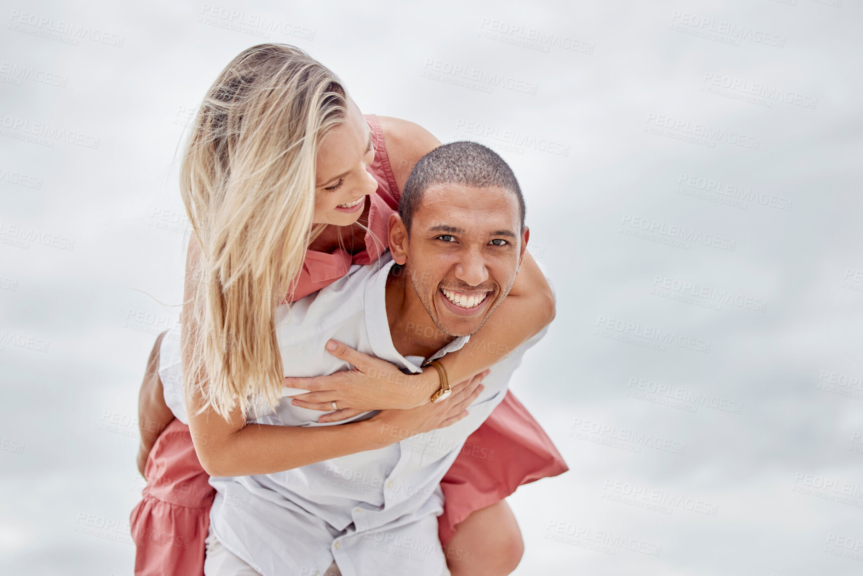 Buy stock photo Love, freedom and couple embrace at beach, happy and relax on summer vacation together. Portrait of interracial man and woman enjoy playful relationship outdoors in nature, having fun bonding on trip