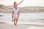Beach, love and summer couple walking on sand together for romance and relaxing date in nature. Young, happy and romantic people in relationship enjoy outdoor fun on ocean vacation break.