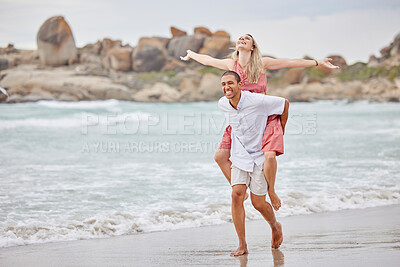 Buy stock photo Beach, love and smile, an interracial couple at the sea during summer vacation. A happy man and woman laugh and a romantic date at the ocean. Waves, sand and romance, summer holiday the African sun.
