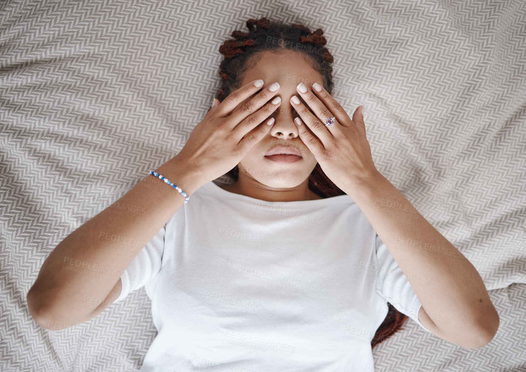 Buy stock photo Stress, anxiety and black woman using hands over eyes to calm, relax and peace in bed. Stress management, mental health and insomnia with sleepless young female lying in bedroom for depression