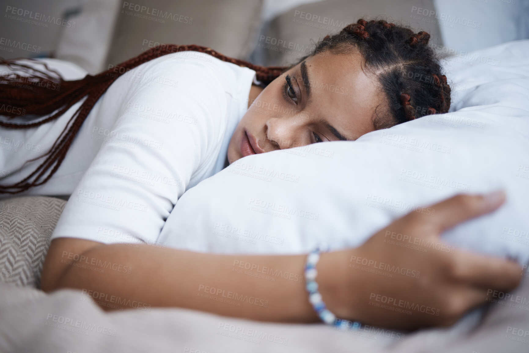 Buy stock photo Bedroom, insomnia and depression of woman mental health problem, anxiety and stress on pillow at home. Sad, depressed and thinking young black person feeling tired, cry and lonely for breakup mistake