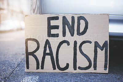 Buy stock photo End racism placard, sign and poster for protest in an urban street background for equality, human rights and race problem. Cardboard or billboard advertising fairness, justice and community freedom
