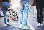 Body sign, street protest and people walking for legal justice,  freedom of choice and abortion law in the city. Woman and man at supreme court against constitution rights on healthcare with poster