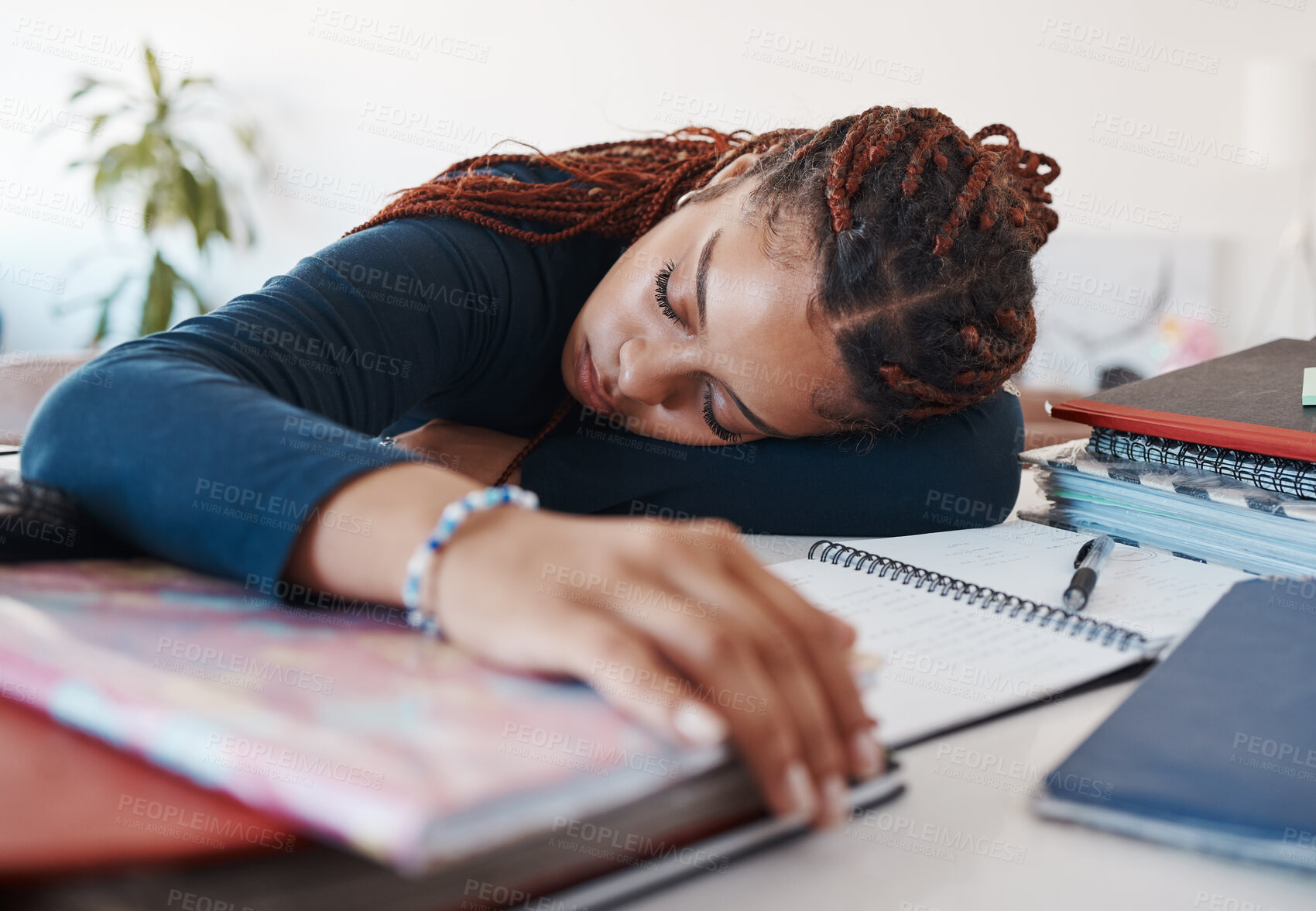 Buy stock photo Tired student sleeping at her desk while studying for university or college exams and test. Burnout young woman lying on desk, fatigue or sleep during study session in her living room at home