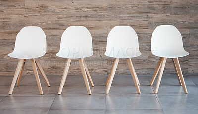 Buy stock photo Hiring staff recruitment drive, interview waiting room and four white office chairs in empty wood wall background. Business opportunity in corporate space and available position to join the team