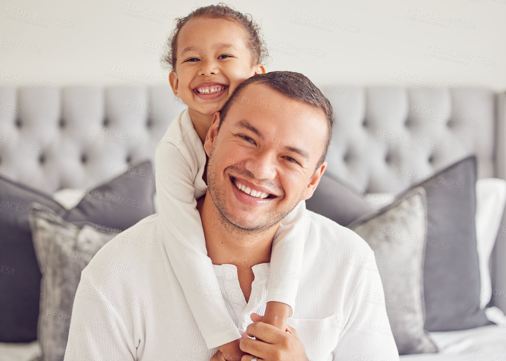 Buy stock photo Children, family and love with a man and his girl sitting on a bed in the bedroom of their home together. Kids, smile and happy with a father and daughter bonding in their house in the morning