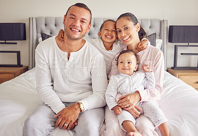 Buy stock photo Family happy, portrait smile and relax on bed together in home, parents love for children in the morning and happiness in bedroom. Mother and father relaxing with kids and caring on the weekend