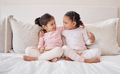 Buy stock photo Happy kids, girls and friends together on the bed holding each other with a smile for friendship at home. Little girl children in friendly sister love and caring relationship smiling in the bedroom