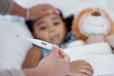 Buy stock photo A child in bed with covid, a fever and thermometer showing temperature. Mother with sick kid with hand on head to check if it is hot or cold. Ill with flu, healthcare and medical care in family home