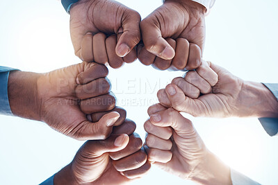 Buy stock photo Diversity, fist bump and success of a corporate team collaboration winning a company business deal. Group, celebration and hands in unity at a business meeting for motivation and achievement.