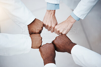 Buy stock photo Doctors fist bump in teamwork motivation and solidarity hands sign for commitment, motivation or goal. Healthcare group of people standing together in support, innovation mission or medical inclusion