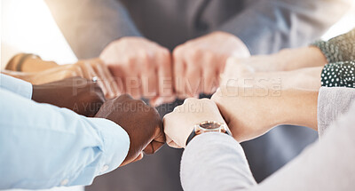 Buy stock photo Hand, collaboration and motivation with the hands of a business team together in a huddle or circle. Teamwork, goal and target with an employee group joining their fists in trust, solidarity or unity