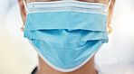 Healthcare, covid and doctor with surgical mask, face closeup and cropped. Safety in hospital for medical worker in surgery or research. Protection against virus and infection for woman in medicine.