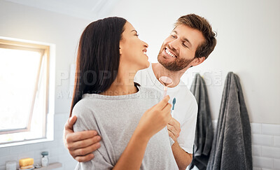 Buy stock photo Couple, bathroom and grooming with woman, smile and man do dental health. Girl, face skincare in morning routine, happy with partner, boyfriend husband brushing teeth, in their home or on holiday