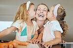 Happy, family and young girls kiss mother in joyful face, smile celebrating mothers day at home. Sisters kissing mom on the cheek in cute playful fun celebration for love and affection in the kitchen