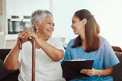 Buy stock photo Senior care, healthcare insurance and caregiver woman sitting with elderly woman patient laughing and talking while enjoying retirement home. Old lady and female nurse hospice with health check form