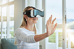 Futuristic woman with VR headset and digital ai with her hands. Young female with futuristic virtual reality goggles, playing an interactive 360 3D simulation game and experience the metaverse