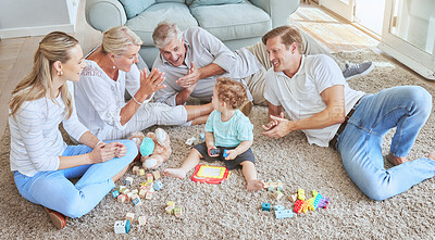 Buy stock photo Family in living room play with baby for education and cognitive development on carpet. Group of people with parents, grandparents and young child have fun with toys on home floor for infant learning
